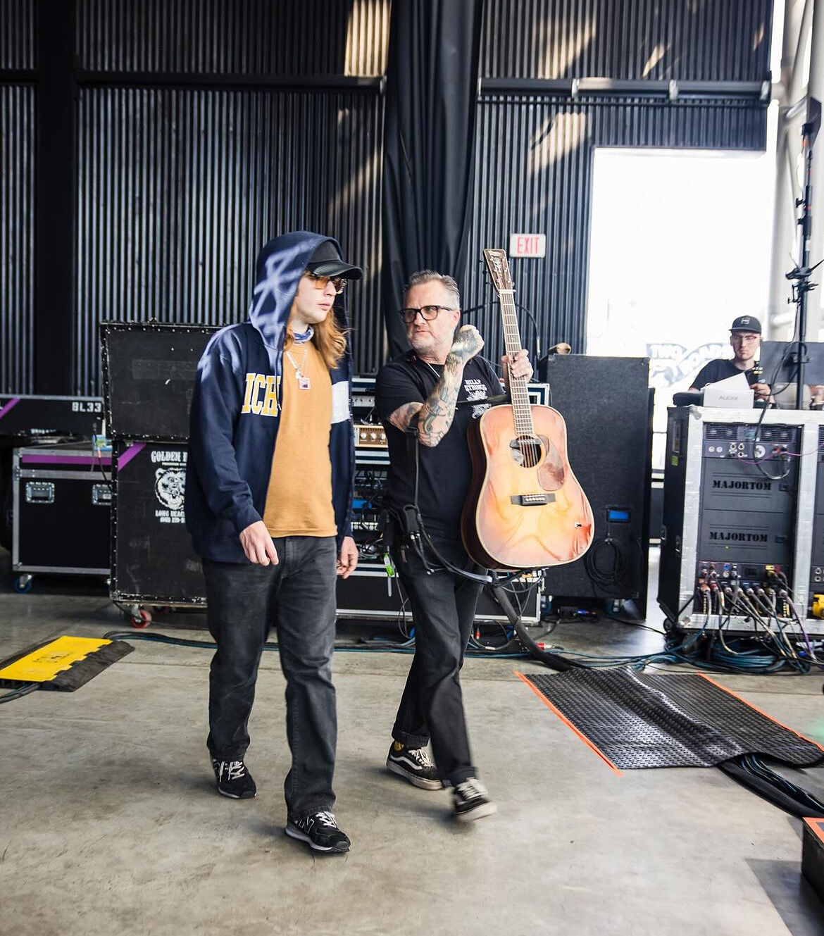Photo of Tobe and Billy Strings walking on stage